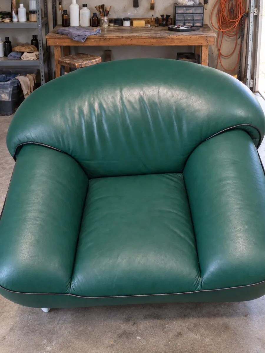 Green leather armchair after restoration