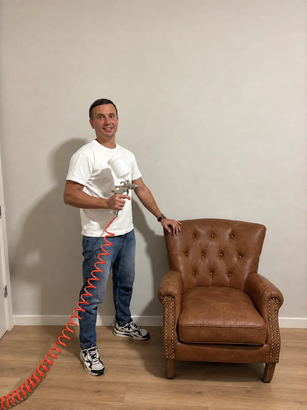 LeatherRevital restoration specialist with a restored leather chair
